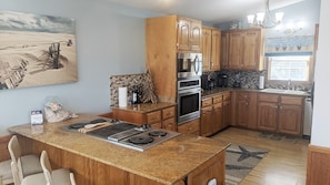 Enjoy cooking in this well-appointed kitchen with oven, stovetop, and sink.
