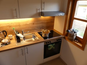 Apartamento, baño privado, vistas al jardín | Cocina compartida