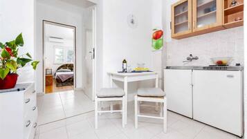 Fridge, stovetop, coffee/tea maker, cookware/dishes/utensils