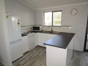 Fridge, microwave, toaster, cookware/dishes/utensils