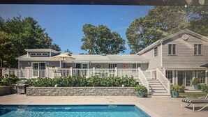A two-story house with a swimming pool, a covered patio, and a fenced yard. - In Sag Harbor Village. Walk to town, and less than 1/2 mile to Havens Beach. (Sag Harbor)