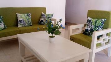 Comfort Apartment | Living area | 43-inch flat-screen TV with digital channels, TV