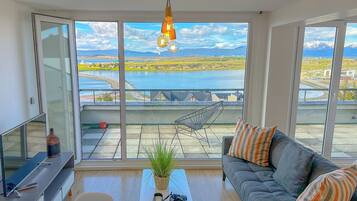 Studio, 1 Queen Bed, Balcony, Canal View | Living area | 43-inch Smart TV with cable channels, TV