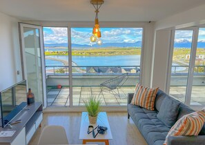 Studio, 1 Queen Bed, Balcony, Canal View | Living area | 43-inch Smart TV with cable channels, TV