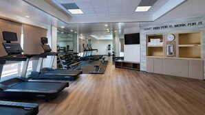 A modern gym with treadmills, exercise equipment, and a motivational quote on the wall. - Fairfield by Marriott Inn & Suites Phoenix West Chandler (Phoenix)