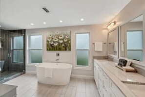Bathtub, hair dryer, towels, soap