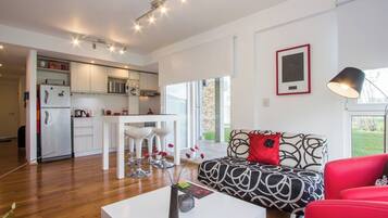 Apartment, 1 Queen Bed with Sofa bed, Balcony, Mountain View | Living area | 43-inch Smart TV with cable channels, TV