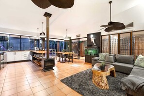 Enjoy a spacious living area with a stove, sofa, and coffee table.