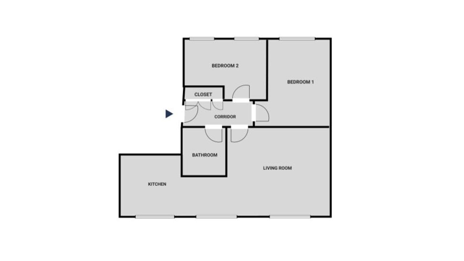 Un plan d’étage comprenant deux chambres, un salon, une cuisine, une salle de bain et un placard.