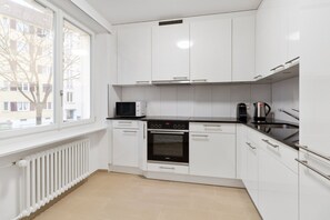 Fridge, microwave, oven, stovetop - Trendy Oerlikon 3.5 Room w/ Balcony, 1min to Train Station, by Blueground (Zurich)