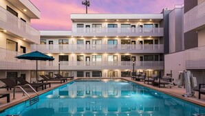 A multi-story hotel with a swimming pool, balconies, and outdoor seating. - UPSCALE Cozy Nashville Condo★ POOL, PATIO, PARKING (Nashville)