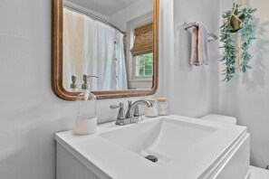 Combined shower/tub, hair dryer, towels, soap