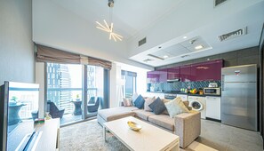 Luxury Apartment | Living area | 43-inch Smart TV with cable channels, TV