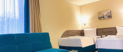 Desk, laptop workspace, free WiFi, bed sheets