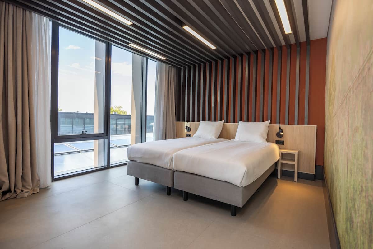 family suite | 1 bedroom, in-room safe, desk, laptop workspace