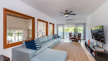Romantic Villa | Living area | 42-inch flat-screen TV with cable channels, TV, iPod dock