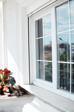 A modern building with large windows and a white exterior. - Apartments Flower Residence (Sarandë)