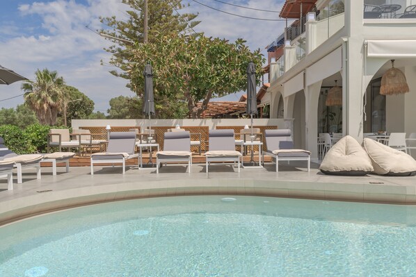 Seasonal outdoor pool, pool umbrellas, pool loungers
