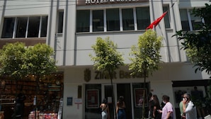 A multi-story hotel building with a sign reading "NEVI HOTEL & SUITES". - Nevi Hotel & Suites İstanbul Taksim (Istanbul)