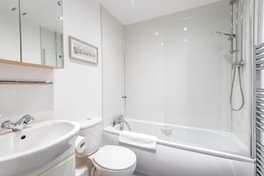 Combined shower/bathtub, hair dryer, towels, soap