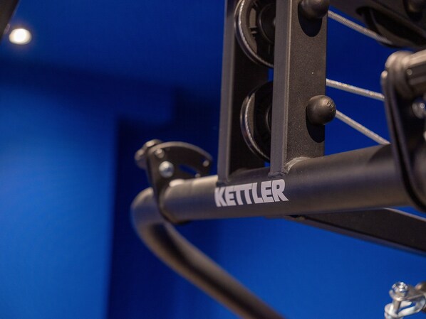 A close-up of a metal structure with the brand name "KETTLER" visible.