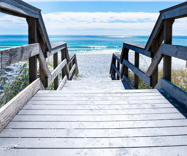 Walk along the boardwalk to the beach.
