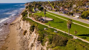An aerial view of a coastal area with a marked "Bluewater Retreat" indicating a residential area with a beach, a road, and a green park. - Bluewater Retreat - Ocean Views from the heart of Santa Barbara (Santa Barbara)