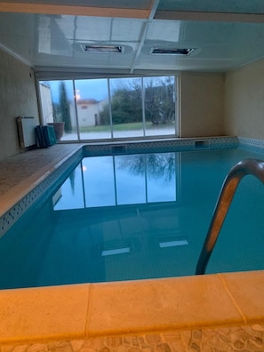 Relax by the pool with a view of the surrounding neighborhood.