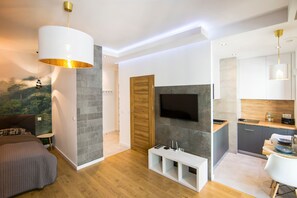 Apartamento empresarial | Área de estar | TV LCD