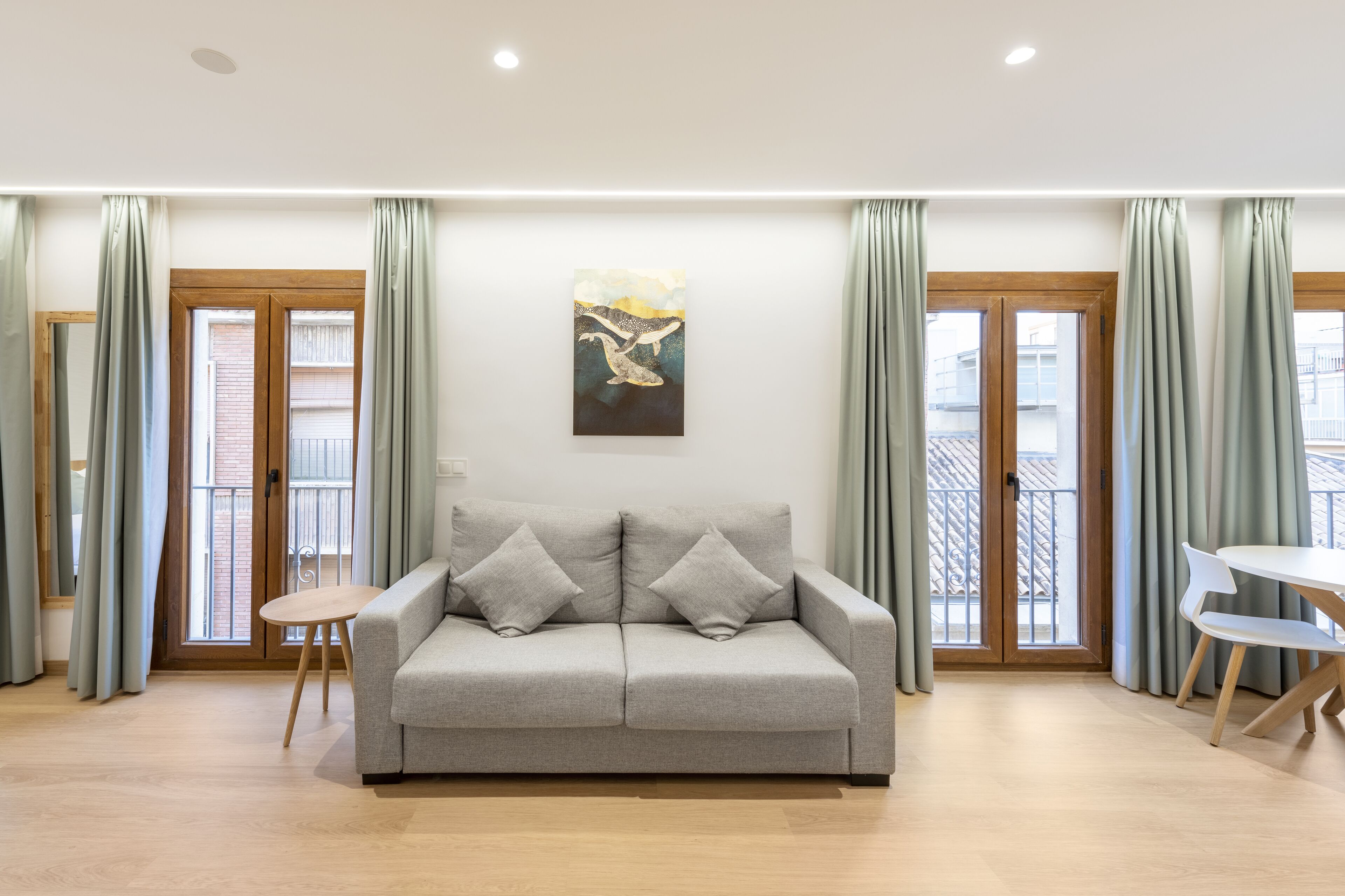 standard studio (no access to pool/rooftop) | living area | 50-inch smart tv with digital channels, tv, mp3 dock