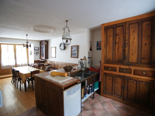 Enjoy cooking in this well-equipped kitchen with a central island, dishwasher, and sink.