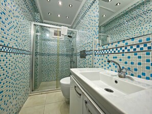 Shower, hair dryer, bathrobes, towels