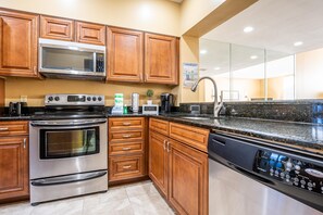 Enjoy cooking in this well-equipped kitchen with a microwave, stove, oven, and dishwasher.