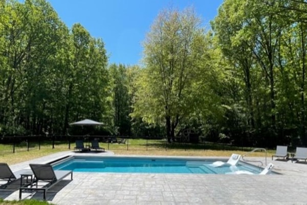 Large heated pool with sun shelf! Plenty of room for relaxing in the sun.