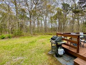 Enjoy al fresco dining on the deck with a barbecue grill and comfortable seating.
