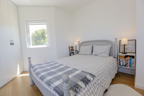 1 bedroom, desk, iron/ironing board, travel crib