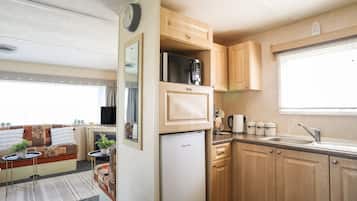 Fridge, electric kettle, toaster, cookware/dishes/utensils