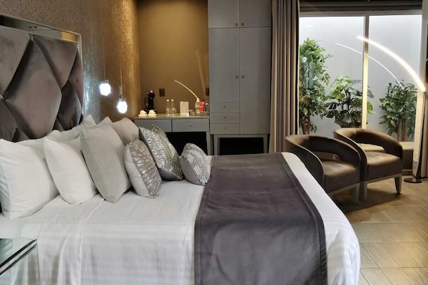 Deluxe Room, Jetted Tub | Down comforters, minibar, in-room safe, individually decorated