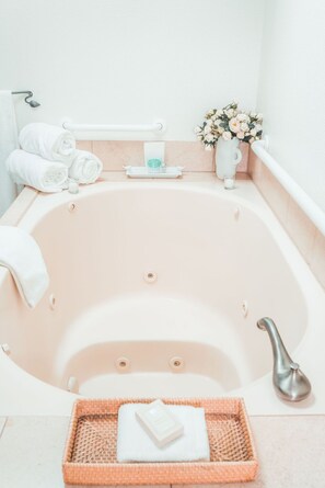 Jetted tub, hair dryer, towels, soap