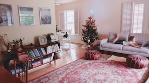 Cozy living room with a bookshelf, coffee table, and comfortable sofa.