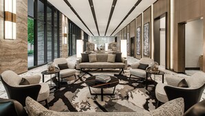 A modern lobby with a central seating area, large windows, and a view of the outdoors. - Ascott Star KLCC Kuala Lumpur (Kuala Lumpur)