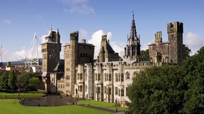 A historic castle with multiple towers and a large courtyard.