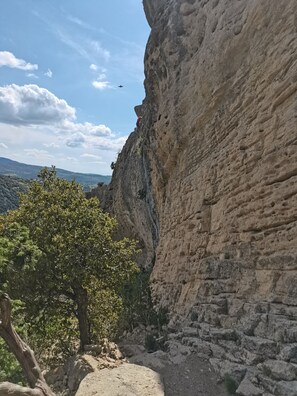 Hikers and climbers can explore the natural rock formation and scenic valley.