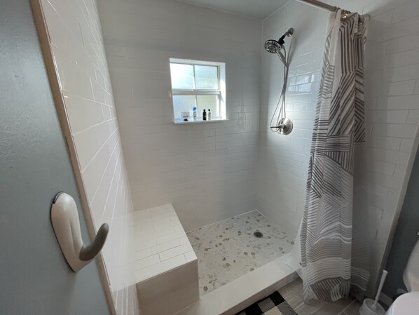 Shower, hair dryer, towels, soap