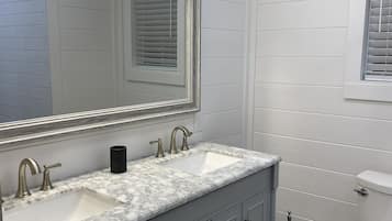 Shower, hair dryer, towels, toilet paper