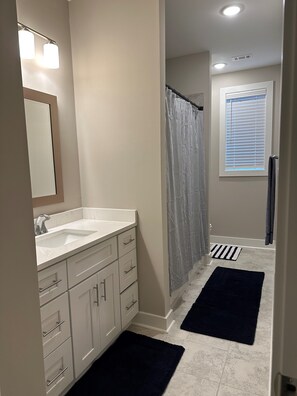 Combined shower/tub, hair dryer, towels, soap