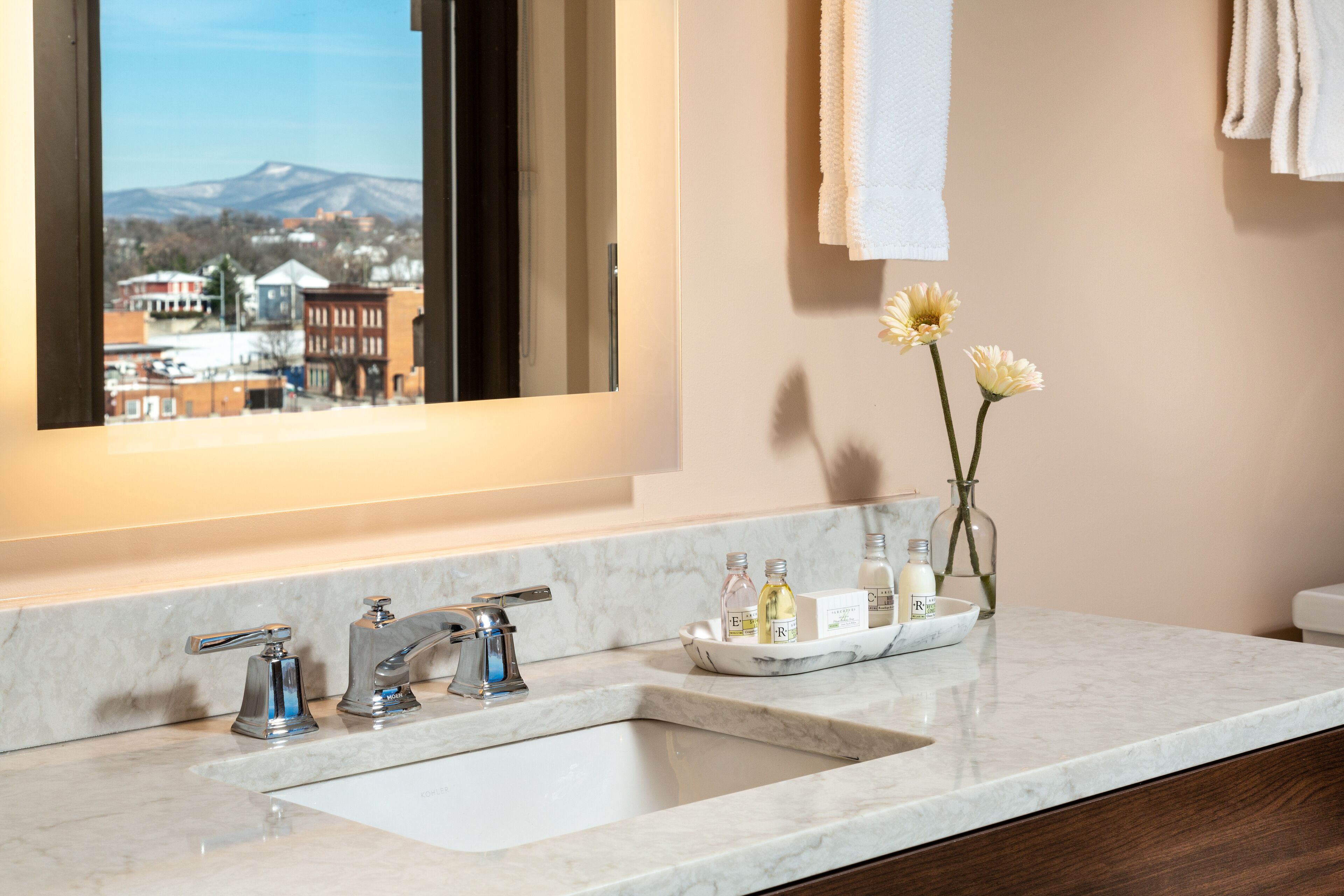 shower, hair dryer, slippers, towels