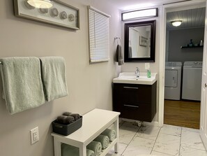 Shower, hair dryer, towels, toilet paper