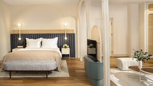 A modern bedroom with a large bed, bedside tables, a TV, and a seating area. - Ecole St Pierre Hotel (Istanbul)