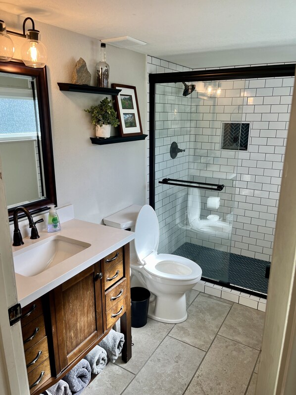 Shower, hair dryer, towels, soap